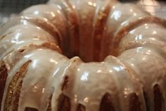 a bundt cake covered in icing on top of a table