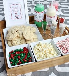 a tray filled with cookies and candy on top of a table