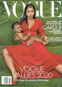 a woman in a red dress holding a baby on the cover of a magazine,