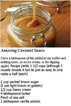 a jar filled with caramel sauce on top of a wooden table