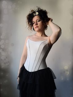 Custom-Made Gothic Bridal Corset by Supermoonax (Designed by Aylin Taş) This bespoke corset features a chic, gothic-inspired design with a cinched bodice and leather bustier, creating an elegant sleeveless top perfect for bold brides.  Ideal for a unique wedding day look, Burning Man festivals, or concerts, this corset makes a statement wherever you go. Material: Hand-stitched, first-quality genuine leather Stainless eyelets Durable laces Available Colors: Black, Beige, Red, Tan, Dark Green, Dar White Evening Bodice, White Fitted Corset Dress For Costume Party, Elegant Corset With Fitted Bodice For Costume Party, Elegant Fitted Bodice Corset For Costume Party, Wedding Overbust Corset With Boning, White Sleeveless Corset Dress For Costume Party, Sweetheart Neckline Corset With Boned Bodice For Costume Party, White Underbust Corset Dress For Party, Wedding Overbust Bodice With Boning