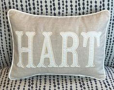 a pillow with the word hart on it