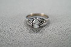 I am offering you this vintage sterling silver, wedding band stacker design ring (stamped). It features a center set prong set oval shaped genuine white topaz stone.  This stone is set in a wonderful raised relief single stone setting. Truly a most spectacular detailed scrolled filigree Victorian -style ring. It is currently a size 8, though I am sure this could easily be sized up or down. It measures app. 3/4 inch, by app. 1/4 inch. It weighs app. 4 grams.   Please review all of my pictures, as Oval Stackable Rings With Rose Cut Diamonds For Anniversary, Anniversary Stackable Rings With Rose Cut Diamonds, Anniversary Engraved Ring With Oval Rose Cut Diamonds, Classic Silver Stackable Rings With Rose Cut Diamonds, Oval Filigree Promise Ring Hallmarked, Classic Oval Topaz Ring For Anniversary, Formal Oval Stackable Rings With Rose Cut Diamonds, Oval Engraved Ring With Rose Cut Diamonds For Wedding, Oval Solitaire Stackable Rings For Anniversary