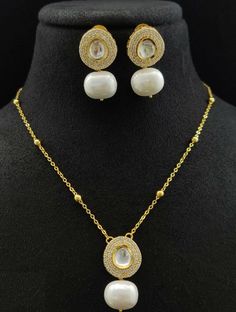 "Golden Pearl Chain / Golden Pearl Necklace / Polki Kundan Pendant Necklace/ White Pearls Chain necklace/ Kundan Pendant Necklace/ JhumkaStop - Trendy Golden Chain Statement Necklace made in Brass with 22 karat gold plating - Necklace comes with chain extension for proper fitting around the neck - Contemporary Minimalist Style Statement Necklace. - 100% guarantee on the finish - Lightweight Indian Jewelry - Necklace Length: Approx. 16 Inches - Earrings: 1\" - Earrings come with Push back closure Elegant Jewelry Sets With Chain For Gift, Gold Chain Necklace With Pearl Pendant For Party, Party Gold Chain Necklace With Pearl Pendant, White Delicate Chain Necklace, Gold Plated Chain Necklaces For Wedding, Pearl Pendant Chain Necklace For Weddings, Gold Kundan Necklace Pendant As Gift, Gold Kundan Pendant Necklace, Silver Plated Round Chain Necklace