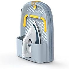 an ironing board is attached to the back of a backpack with two yellow handles