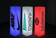 three different colored boxes with nike logos on them