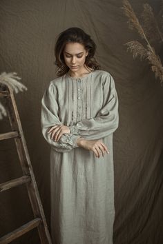 "Pure linen, long sleeved, with beautiful handstitched front yoke night gown for woman. The delicate handwork on the front creates the lightness and brings us to earlier our mum's time. That will be perfect gift for your mother or grandmother or to everybody who loves vintage. At the front fastening with 5pearl buttons, front yoke and gathering at yoke bottom. Sleeves with cuff and buttoned. Gown bottom sides are finished curved. Gown center back length - from neck line till hem - 45.5 \" (115 c Spring Long Sleeve Nightgown For Bedtime, Long Sleeve Nightgown For Spring Bedtime, Long Sleeve Bedtime Dress For Spring, Long Sleeve Dresses With Lace Trim For Night, Long Sleeve Lace Trim Dress For Night, Long Sleeve Dresses For Loungewear, Spring Long Sleeve Nightgown For Night, Long Sleeve Loungewear Dresses, Elegant Long Sleeve Spring Nightgown