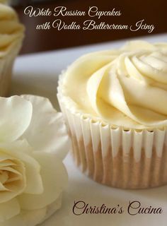 cupcakes with vanilla buttercream icing on a plate