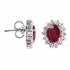 This Sterling Silver Earring features an Elegant Art With Natural Ruby Gemstone surrounded by tiny Zircon Gemstones. The cavity is made from genuine solid 925/92.5 Sterling silver and stamped as S925. This Jewelry is Lead free and finished with Rhodium to resist scratches and tarnish. ITEM DESCRIPTION Item Code: JAER131 Metal: 925/92.5 Sterling Silver Gemstone: Genuine Natural Ruby Faceted (Fissure filled) Gemstone Shape: Oval Gemstone Size: 6 x 8 MM Earring Length: 13 MM Earring width: 11 MM We Red Ruby Earrings, Ruby Earrings Studs, Sapphire Earrings Studs, Dainty Studs, Oval Earring, Tiny Stud Earrings, Ruby Earrings, Elegant Art, Earrings Red