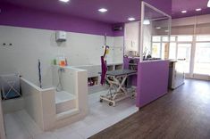 a room with purple walls and white floors