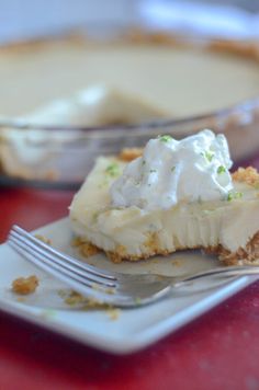 a piece of pie sitting on top of a plate with a fork next to it