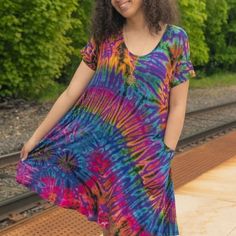 Stretchy Tie Dye Dress With Pockets. One Size Fits Most. Looks Amazing On All Sizes From 6-16 Casual Purple Mini Dress For Day Out, Casual Purple Beach Dress, Flowy Multicolor Mini Dress Casual, Purple Mini Dress With Short Sleeves For Day Out, Casual Flowy Multicolor Mini Dress, Multicolor Flowy Mini Dress With Short Sleeves, Summer Purple Short Sleeve Dresses, Casual Flowy Purple Dress, Flowy Multicolor Mini Dress With Short Sleeves