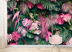 pink and green tropical leaves wallpaper mural in a living room