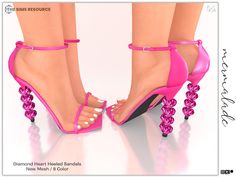 a pair of pink high heeled sandals with pearls