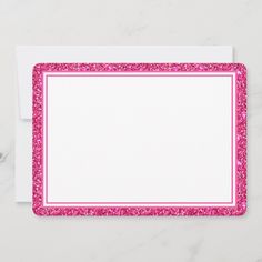 a pink and white rectangular place mat with sparkles on it, in the shape of a rectangle