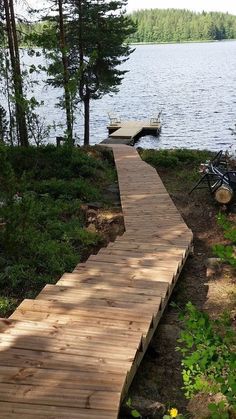 a wooden walkway leading to a boat dock