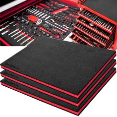 a bunch of tools that are in a red and black tool box on top of each other