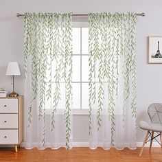 the curtains in this room have green leaves on them