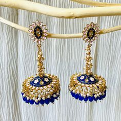 A beautiful handpainted meenakari jhumki earring.It's unique design is surely a show stopper for any occasion. High quality material and workmanship for this piece to be your forever friend. Product Include: Earrings Explore our shop for more beautiful pieces: https://www.etsy.com/shop/KoohooUS Care tips: - Keep away from contact with nail polish removers, perfumes, body oils, and other household chemicals - Put the jewelry last while getting ready as hair styling products may damage metal polis Meenakari Earrings, Nail Polish Removers, Photography Settings, Hair Styling Products, Earrings Indian, Body Oils, Kundan Earrings, Pool Spa, Jhumka Earrings