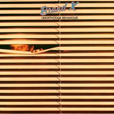 a person peeking out from behind blinds with the words brain x in front of them