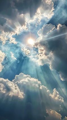 the sun is shining through clouds in the sky