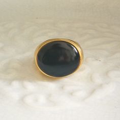 Tracked shipping is used for ALL orders including international orders. International customers are able to track your orders online and be assured that it will arrive safely and everything is covered.* . .This is a very eye-catching and beautiful statement signet ring made of 18CT gold over solid sterling silver and features a large black onyx stone. The band is very sturdy. Please let me know your finger size after ordering.  Important notice: . During busy holiday period international deliver Modern Oval Cabochon Signet Ring, Minimalist Oval Cabochon Signet Ring For Formal, Minimalist Oval Cabochon Signet Ring For Formal Occasions, Modern Oval Dome Ring For Gift, Modern Oval Dome Ring As Gift, Modern Oval Cabochon Signet Ring For Gift, Modern Oval Cabochon Signet Ring As Gift, Modern Oval Cabochon Dome Ring, Minimalist Oval Gemstone Signet Ring