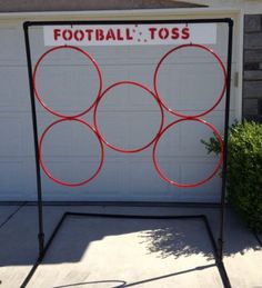 a sign that says football toss in front of a garage