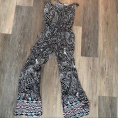 Adorable Black Jumpsuit With Geometric Pattern And Design At Ankles. Tie Around Waist To Tighten. Size Small And Never Worn! Perfect For A Day At The Pool Or Beach Casual Spring Jumpsuits And Rompers With Paisley Print, Casual Paisley Print Jumpsuits And Rompers For Spring, Casual Summer Paisley Print Jumpsuits And Rompers, Casual Paisley Print Jumpsuits And Rompers For Summer, Casual Paisley Print Jumpsuit For Summer, Casual Black Printed Jumpsuit/romper, Casual Black Printed Jumpsuit, Fitted Printed Patterned Jumpsuits And Rompers, Trendy Black Printed Jumpsuits And Rompers