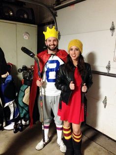 a man and woman in costumes standing next to each other