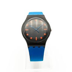 Authentic Swatch New Gent Non Slip Watch SUOB121. The Swatch New Gent Non Slip is a men's watch with a sporty design with blue, black and orange hues. The watch comes from the Sport Mixer series and features a dark blue silicone strap that is black on the back side. The strap has a bright orange tip, a black loop and a black pin buckle. The 41 mm plastic case is black. The black dial has orange dots, triangles and indexes to mark the hours and dark blue hands. This waterproof watch has an accurate quartz movement with a battery. Everyone knows a Swatch when they see one. What started in 1983 in Switzerland has revolutionized the watch industry. Swatch watches are inexpensive but they are Swiss made and therefore made to last. There are Swatch watches for people of all ages, and a Swatch fo Orange Dots, Orange Hues, Sporty Design, Black Pins, Swatch Watch, Waterproof Watch, Black And Orange, Swiss Made, Men's Watch