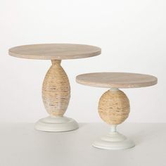 two round wooden tables sitting on top of each other