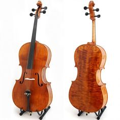 two violin's side by side, one with the back turned to the camera