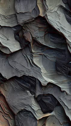 an image of some rocks that look like they have been painted black and grey with red highlights