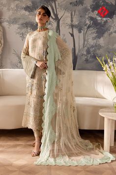 Elanora by Nureh is a luxurious chiffon collection featuring intricate embellishments and exquisite embroidery. Elevate your wardrobe with these elegant, statement-making designs perfect for special occasions.

Price: PKR16,000/-

SKU: HF-B010-NUEN-D005-10/24 Embroidered Suits, Hand Embellishment, Organza Suits, Gold Gown, Chiffon Sleeves, Organza Sleeves, Chiffon Collection, Embroidered Chiffon, Embroidered Organza