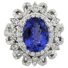 7.00 Carat Natural Tanzanite 14 Karat Solid White Gold Diamond Ring Stamped: 14K Total Ring Weight: 7.1 Grams Tanzanite Weight 6.00 Carat (12.00x10.00 Millimeters) Diamond Weight: 1.00 carat (F-G Color, VS2-SI1 Clarity ) Face Measures: 22.55x19.95 Millimeter SKU: [600533] Emerald Eternity Ring, African Inspired Jewelry, Tanzanite And Diamond Ring, 14k White Gold Diamond Ring, Tanzanite Diamond Ring, Tanzanite Diamond, La Face, Gold Diamond Ring, White Gold Diamond Rings