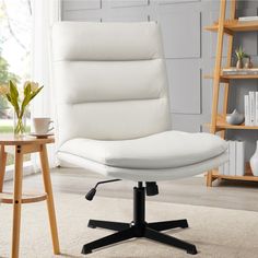 a white office chair sitting on top of a rug