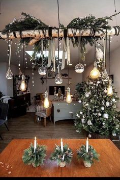 Christmas Diy Farmhouse, Hanging Christmas Table Decorations, Christmas Light Ceiling Decor, Hanging Centrepieces Christmas, Hanging Over Table Decor, Christmas Ceiling Light Decorations, Christmas Light Chandelier Diy, Over Table Hanging Decorations Diy, Hanging Christmas Decor Over Dining Table