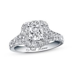 a diamond engagement ring with the words new love written on it and surrounded by diamonds