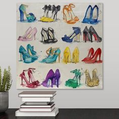 a painting with many different colored shoes on the wall next to books and a potted plant