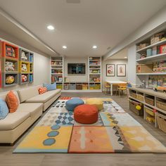 a living room filled with furniture and lots of bookshelves on the wall next to each other