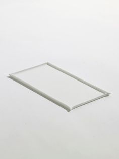 an empty white plate sitting on top of a table