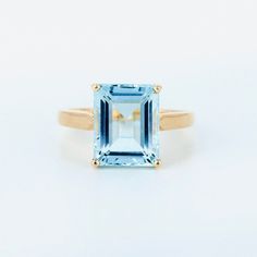 Add this beautiful aquamarine ring to your jewellery collection. Makes for a great gift. We used natural Aquamarine of the finest quality. Product Details > Gemstone - Aquamarine > Materials - 14K Yellow Gold > Gemstone Shape - Rectangle shape > Gemstone weight - 4.71 carats > Gemstone Size: 9X11 mm Rectangle Approx > Ring size : 7 1/2 US > Number of gemstone - 1 pcs > Gross Weight - 4.190 grams > Setting type - prong setting *Production Time: Generally we keep stock of all products but if by an Emerald Cut Light Blue Jewelry For Weddings, Light Blue Emerald Cut Jewelry For Wedding, Light Blue Emerald Cut Wedding Jewelry, Aquamarine Birthstone Ring For Promise, Light Blue Solitaire Ring For Anniversary, Light Blue Emerald Cut Gemstone Jewelry, Light Blue Emerald-cut Gemstone Jewelry, Light Blue Emerald Cut Fine Jewelry, Classic Light Blue Emerald Cut Jewelry