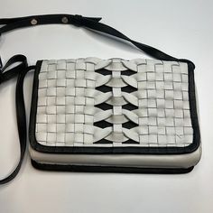 Fun And Stylish Crossbody By Cole Haan! Ivory And Black Woven Design. Removable And Adjustable Strap. One Interior Pocket. Foldover. Magnetic Closure. *This Bag Was A Floor Model, And Shows Signs Of Handling (Pictured). Nwt! 6.24 White Leather Shoulder Flap Bag, White Shoulder Bag With Leather Handles For On-the-go, White Rectangular Shoulder Bag With Magnetic Closure, White Flap Bag With Adjustable Strap For Travel, White Crossbody Flap Bag With Detachable Strap, White Crossbody Flap Bag For Travel, White Evening Clutch Flap Bag, White Crossbody Flap Bag, White Leather Rectangular Flap Bag