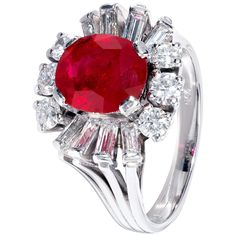 This one-of-a-kind white gold ring brings together an inviting cabochon ruby and round brilliant white diamonds in a design that’s both intricate and graceful. The centre stone, specially selected from the Haruni vault, is a bright red oval ruby, whose natural beauty is emphasised by the 12 sparkling diamonds arranged around it. Ring Size: UK - L, US - 5 3/4 3.04 Carat Ruby Luxury Ruby And Diamond Oval Cabochon Ring, Luxury Ruby Ring With Oval Cabochon Diamond, Luxury Ruby Gemstone Ring In Platinum, Luxury Ruby Ring With Diamond Accents And Round Shape, Luxury Ruby Ring With Platinum Center Stone, Luxury Platinum Ruby Ring With Center Stone, Luxury Round Ruby Ring With Diamond Accents, Platinum Ruby Ring With 17 Jewels, Formal Ruby Ring With Diamond And Oval Cabochon Shape