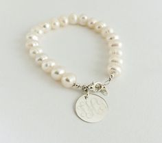 Monogram Freshwater Pearl Bracelet with Sterling by netexchange Classic Personalized Pearl Bracelet, Personalized Classic Pearl Bracelet, Classic Personalized White Pearl Bracelet, Elegant Personalized Round Bead Pearl Bracelet, Personalized Round Bead Pearl Bracelet In Elegant Style, Pearl Bracelet With Pearl Charm For Bridesmaids, Personalized Elegant Pearl Bracelet, Elegant Personalized Pearl Bracelet, Personalized Round Bead Pearl Bracelet