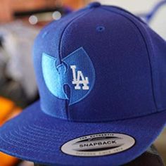 Wu Tang X Los Angeles Dodgers Snapback Embroidered Hat I Embroider All The Products On My Page Myself So My Items Are Priced Accordingly. I Use Quality Yupoong Classic Snapbacks For My Hats. The Size Is An Adjustable Snapback From 6 5/8" To 7 5/8". Thanks For Looking!! Fitted Cotton Snapback Hat, Blue Cotton Snapback Fitted Hat, Blue Fitted Hat With Embroidered Logo And Curved Brim, Blue Cotton Fitted Hat, Fitted Cotton Snapback Hat With Flat Bill, Blue Cotton Fitted Hat With Flat Brim, Blue Fitted Hat With Embroidered Logo For Streetwear, Blue Fitted Hat With Curved Bill For Streetwear, Blue Baseball Cap With Embroidered Logo