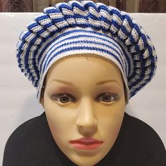 a mannequin head wearing a blue and white hat