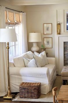 a living room filled with furniture and a fire place