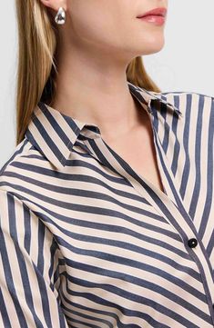 Look crisp and polished all day in this button-up shirt made from a non-iron cotton blend and finished with yarn-dyed stripes. 28" length (size 8) Front button closure Spread collar Long sleeves with button cuffs 58% cotton, 37% polyester, 5% spandex Machine wash, tumble dry Imported Elegant Shirt With Vertical Stripes For Daywear, Pinstripe Collared Shirt For Work, Pinstripe Shirt With Placket For Work, Workwear Shirt With Vertical Stripes And Spread Collar, Collared Shirt With Vertical Stripes For Work, Vertical Stripes Button-up Workwear Shirt, Striped Business Tops With Buttons, Pinstripe Blouse With Button Closure For Work, Striped Blouse With Placket For Work