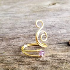 This beautiful wire wrapped ring resembles a whale spout and is made out of high quality non-tarnish coated copper wire and a beautiful light purple amethyst stone. Delicate and free spirited, this boho statement ring is sure to get many admiring glances!Name: Whale SpoutSIZING: You can choose from sizes 3 to 14! WIRE COLORS: Gold, Silver, Rose Gold, Copper, Vintage Bronze and Antique Copper.STONE: Amethyst - The birthstone for February. A stone of spiritual protection and purification, cleansin Unique Handmade Adjustable Amethyst Ring, Adjustable Bohemian Amethyst Ring For Gifts, Adjustable Bohemian Amethyst Ring As Gift, Bohemian Adjustable Amethyst Ring As Gift, Handmade Adjustable Amethyst Crystal Ring, Hand Forged Adjustable Purple Jewelry, Adjustable Hand Forged Purple Jewelry, Adjustable Purple Copper Wire Jewelry, Hippie Rings